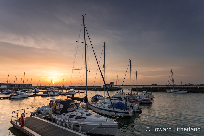 Boats in Victoria Dock at sunset at Caernarfon, North Wales