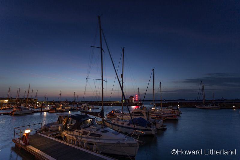 Boats in Victoria Dock at twilight at Caernarfon, North Wales