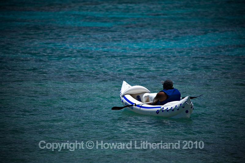 Canoeist in the sea, St Martin, Carribean