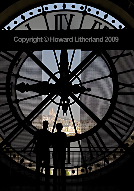 Couple and clock in the Musee d'Orsay, Paris, France