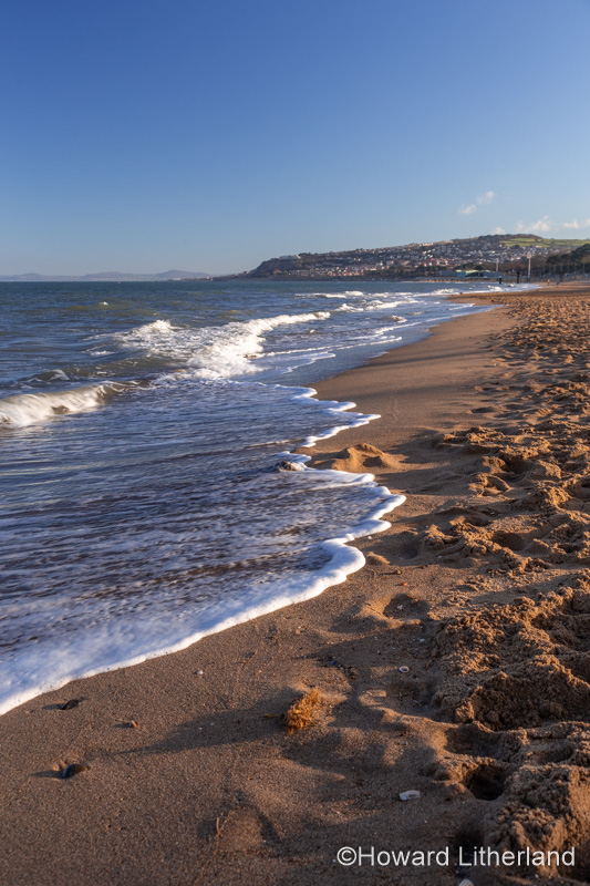 Waves and beach at Colwyn Bay, North Wales coast