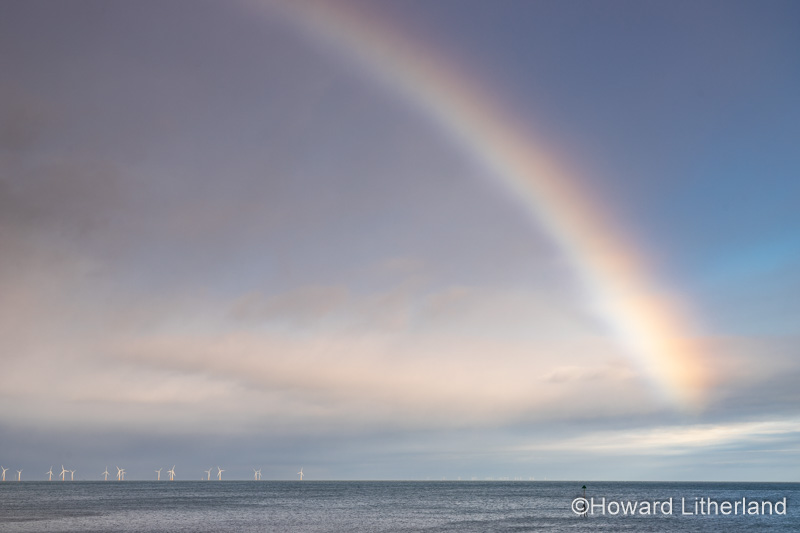 Rainbow over the Gwynt-y-Môr offshore wind farm in Colwyn Bay, North Wales