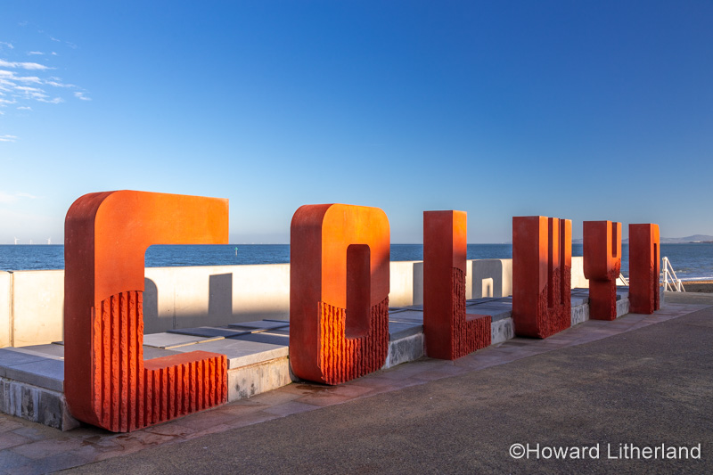 Red concrete Colwyn sign at Colwyn Bay, North Wales coast