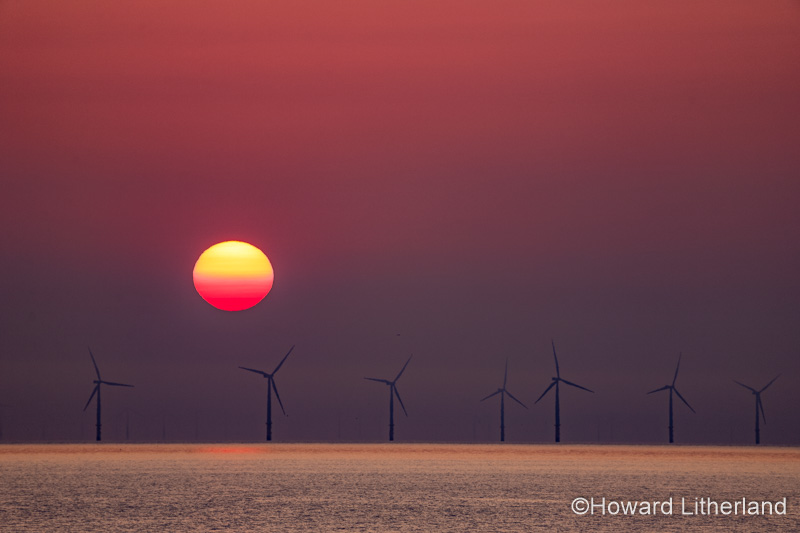Sunset over the Gwynt-y-Môr offshore wind farm, Colwyn Bay, North Wales