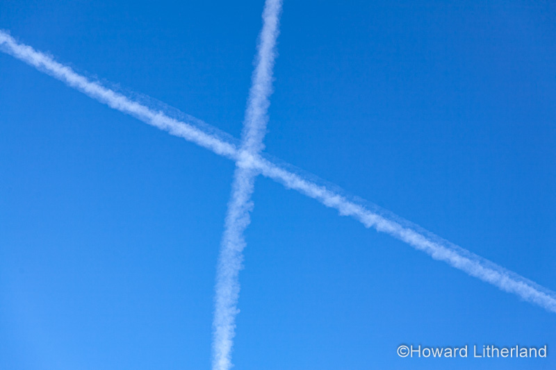 Two aircraft contrails in the form of a cross
