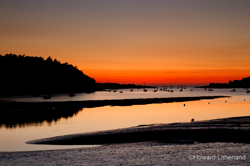 Colourful sky at dusk over the Conwy Estuary on the North Wales coast