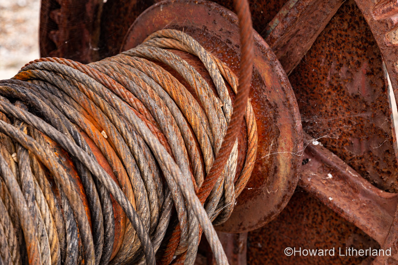 Old rusty cable drum and steel cable at Charlestown, Cornwall