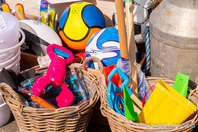 Colourful plastic beach toys for sale at Port Isaac, Cornwall, Enlgand