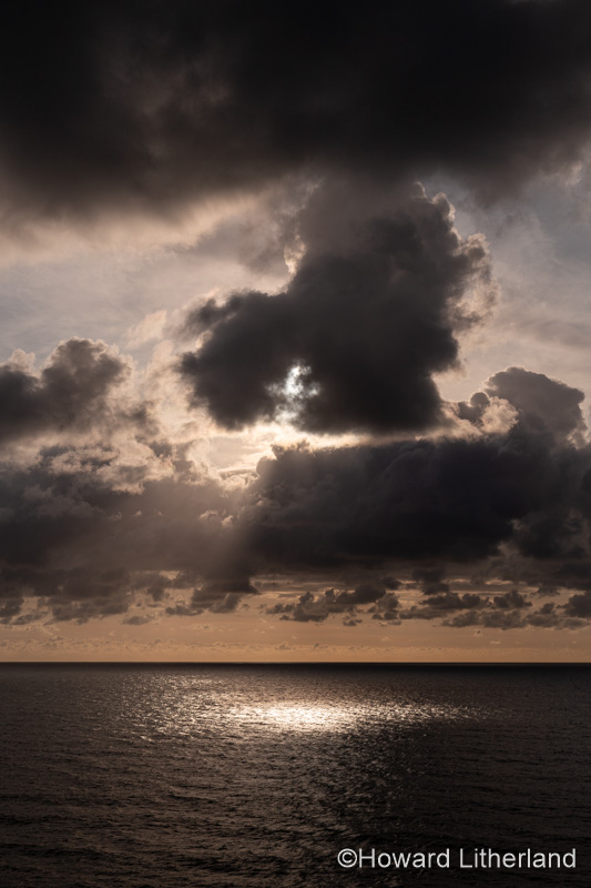 Clouds and sunlight over the Atlantic ocean at Widemouth Bay, Cornwall, England