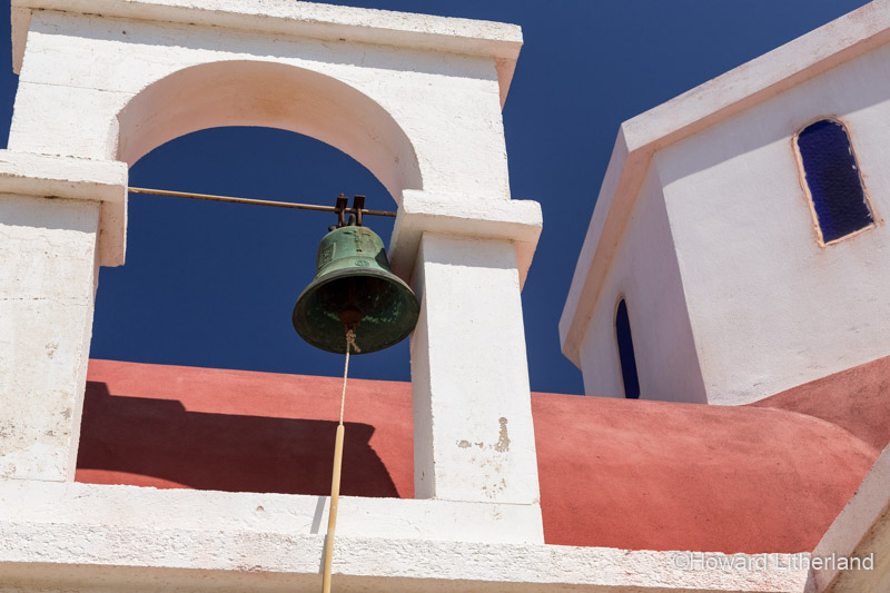 Bell and roof of the greek orthodox church Agia Fotini on the north coast of Crete