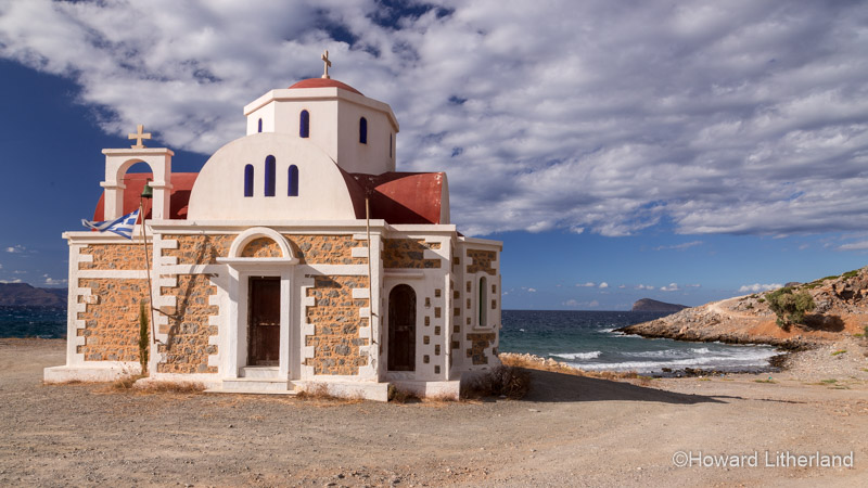 The greek orthodox church Agia Fotini on the north coast of Crete with clouds