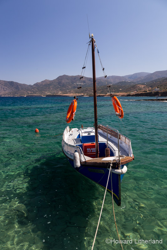 Small colourful boat moored at Mochlos on the Mediterranean island of Crete