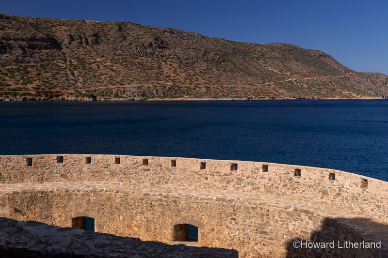 Fortified wall in sunlight on the island of Spinalonga, Crete