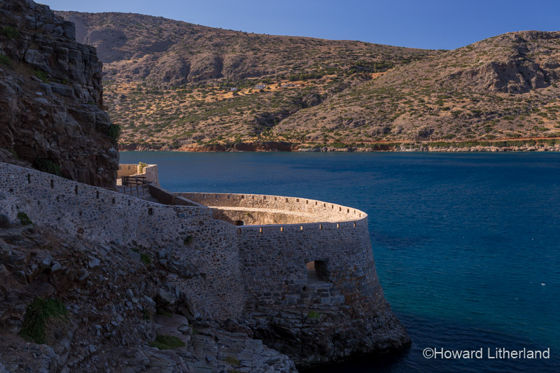 Fortified wall in sunlight on the island of Spinalonga, Crete