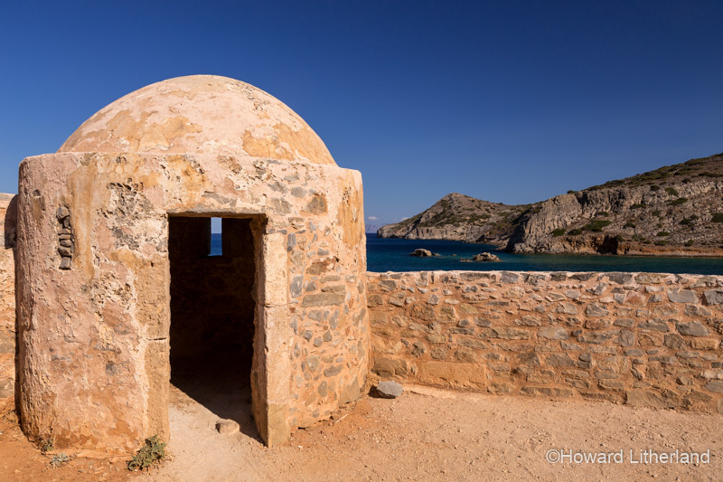 Fortified turret in sunlight on the island of Spinalonga, Crete