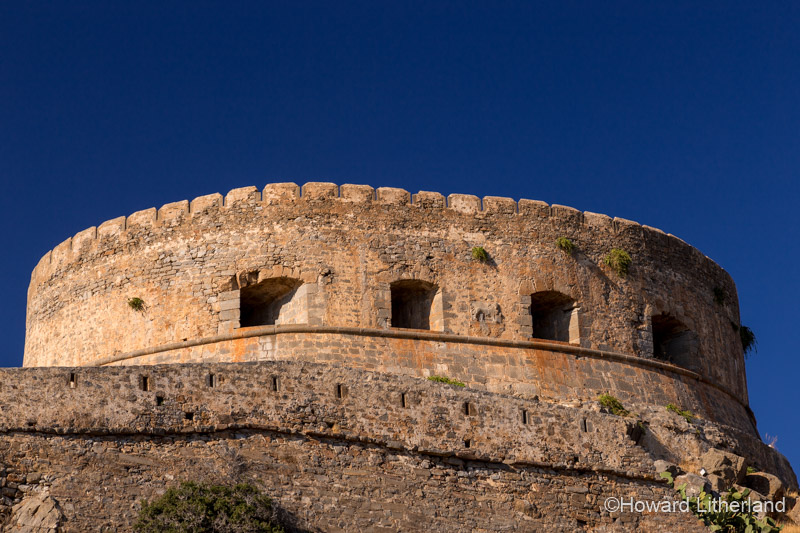 Venetian fortifications in sunlight on the island of Spinalonga, Crete