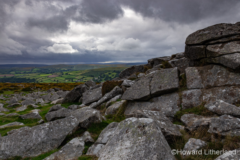 Storm clouds over granite tor on Dartmoor, Devon, England
