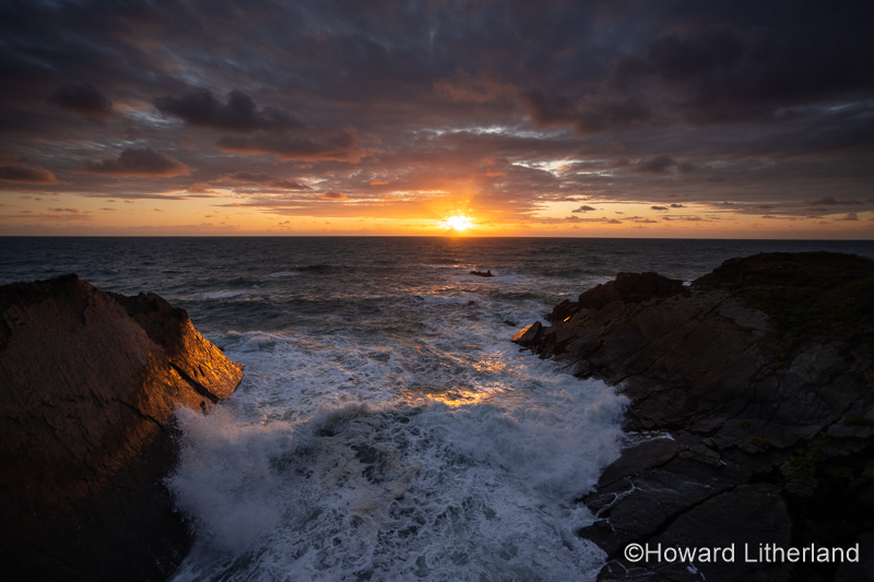 Sunset over the Atlantic ocean at Hartland Quay, Devon, England