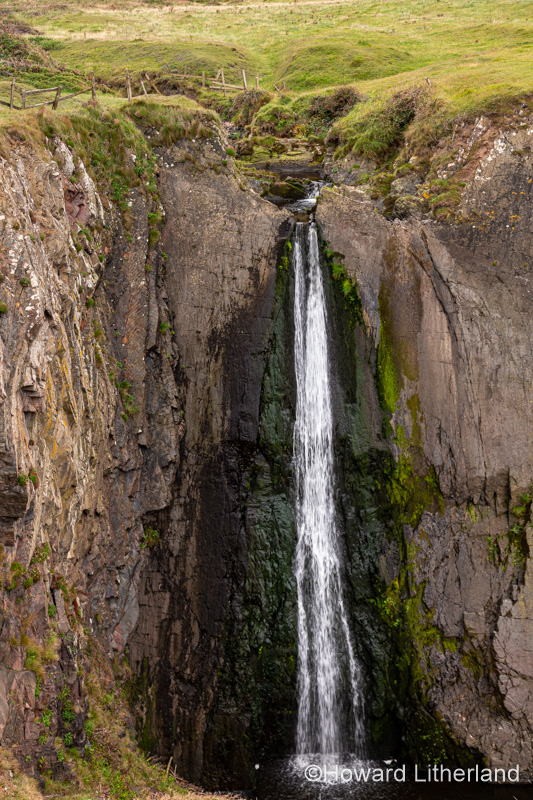 Speke's Mill Mouth waterfall at Hartland Quay, Devon, England