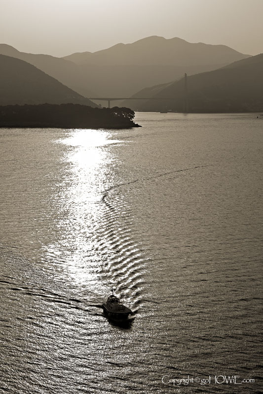Pilot boat with the Franjo Tuđman suspension bridge in the background, Dubrovnik, Croatia