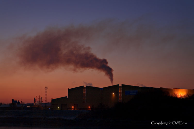 Photo of a smoke plume over a factory on the banks of the river Dee at Queensferry, North Wales