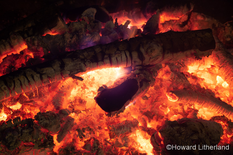 Glowing hot bonfire wood embers