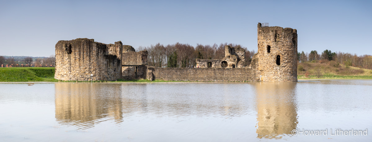 Panoramic view of Flint castle at high spring tide, North Wales coast