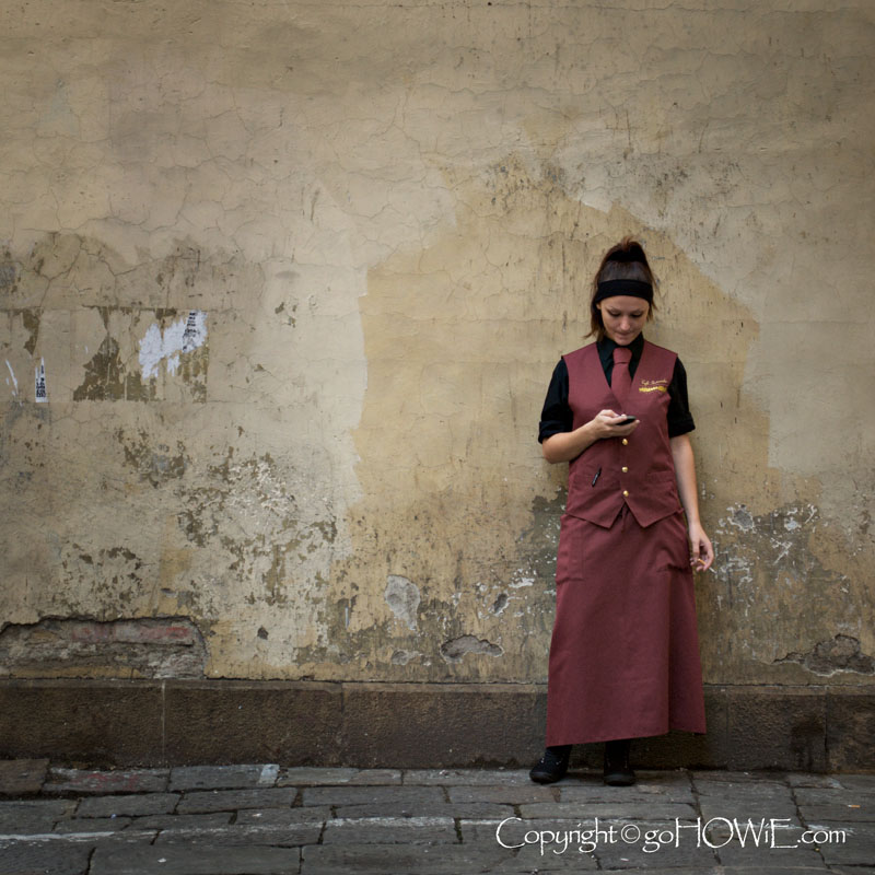 Waitress on her break at the Ponti Vecchio in Florence, Italy
