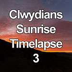 Time lapse of clouds lit by the rising sun, North Wales