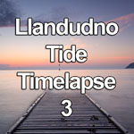 Time lapse video showing the tide coming in up a wooden jetty on the beach at Llandudno on the North Wales coast at dawn