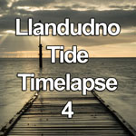 Time lapse video showing the tide receding along a wooden jetty on the beach at Llandudno on the North Wales coast at sunrise