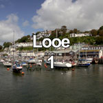 This video features the harbour at Looe on the south coast of Cornwall, England, with small boats moored in the sunshine
