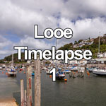 This time lapse video shows summer cumulus clouds moving over small boats moored in Looe harbour on the south coast of Cornwall, England