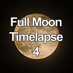 HD video of a large full moon rising through the night sky