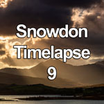 Time lapse video of storm clouds and sunbeams at sunset boiling over the peaks of the Snowdon Horseshoe in the Snowdonia National Park, North Wales