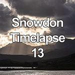 Time lapse of storm clouds and light beams over Snowdon mountain, North Wales