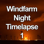 Time lapse video showing the Colwyn Bay windfarm off the North Wales coast at night, lit by a gas flare