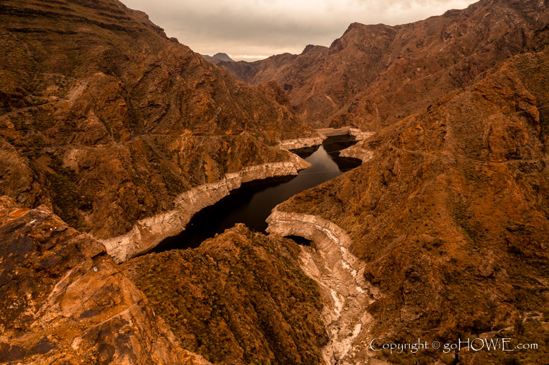 The depleted Presa del Parralillo reservoir near Artenara, Gran Canaria, Seychelles