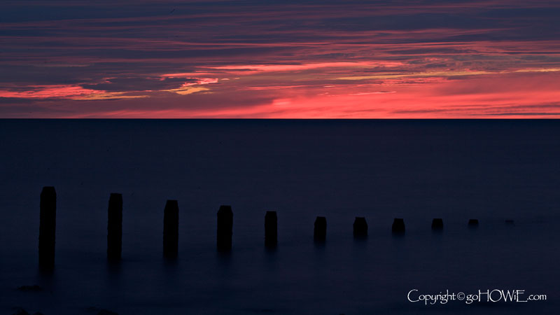 Groynes, dusk, Llandulas, North Wales