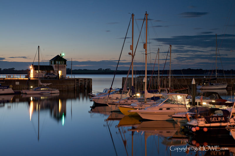 Caernarfon harbour at dusk with yachts, North Wales coast