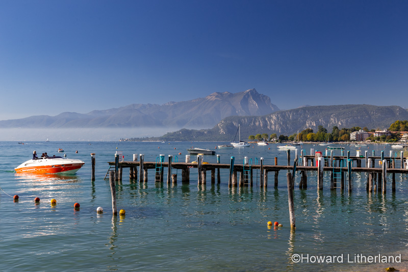 Speedboat and jetty at Bardolino on the shores of Lake Garda in northern Italy