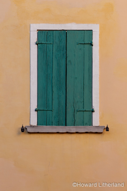 Shuttered window at Castellaro Lagusello near Lake Garda in northern Italy