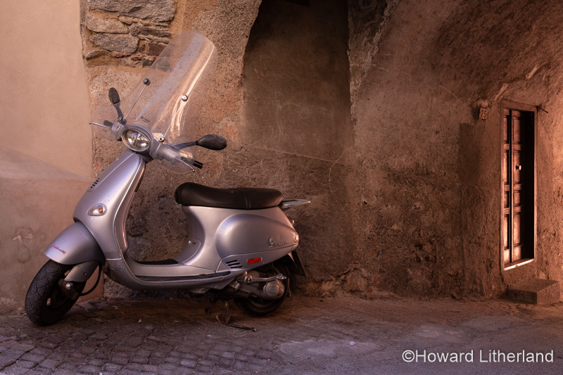 Scooter parked in an alleyway in the town of Bagolino above Lake Idro in northern Italy
