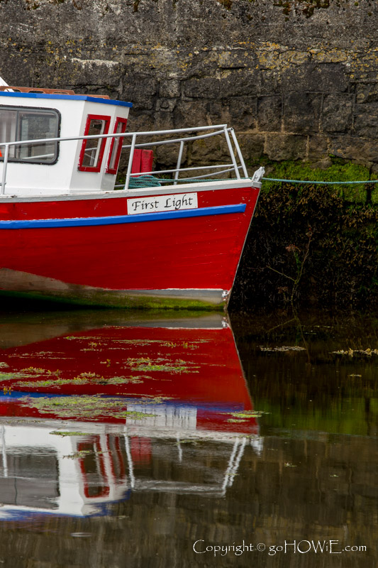Small red boat in the harbour at Kinvarra, County Galway, Ireland