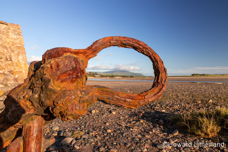 Old rusty anchor on the beach at Ravenglass, Lake District, England