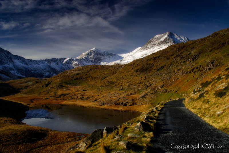 The Miner's Path in winter, showing Llyn Teyrn and the Snowdon Horseshoe, Snowdonia, North Wales