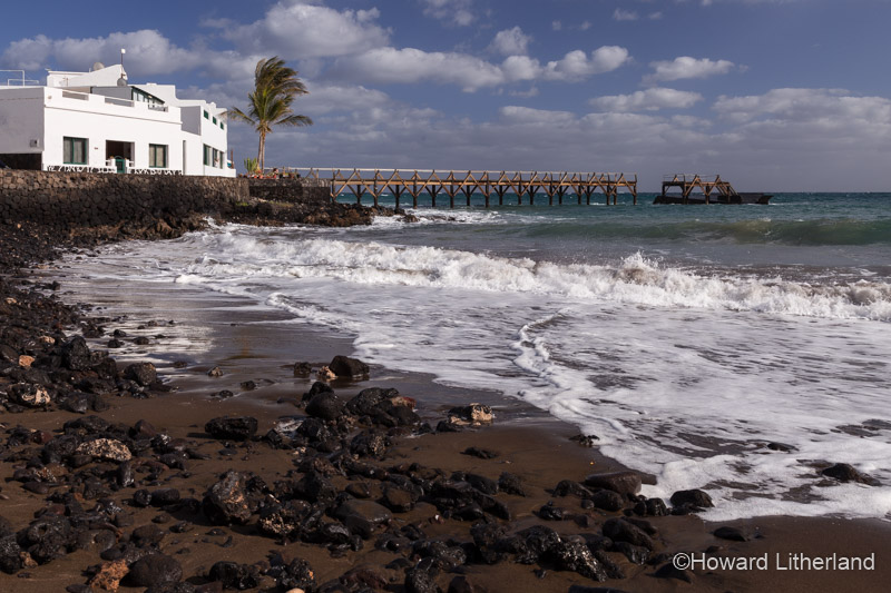 Jetty and shoreline at Arrieta on the Atlantic coast of Lanzarote in the Canary Islands