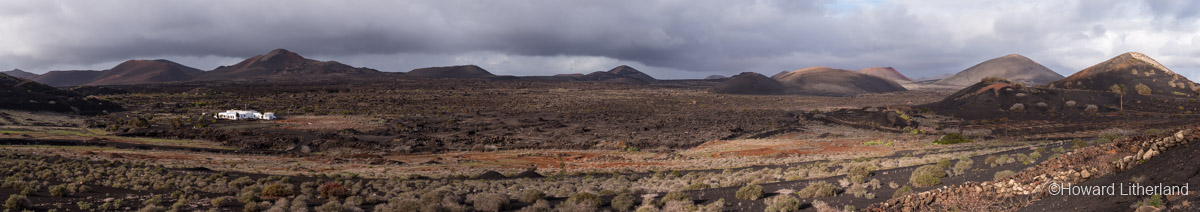 Panoramic image of rugged volcanic landscape around La Geria on Lanzarote in the Canary Islands