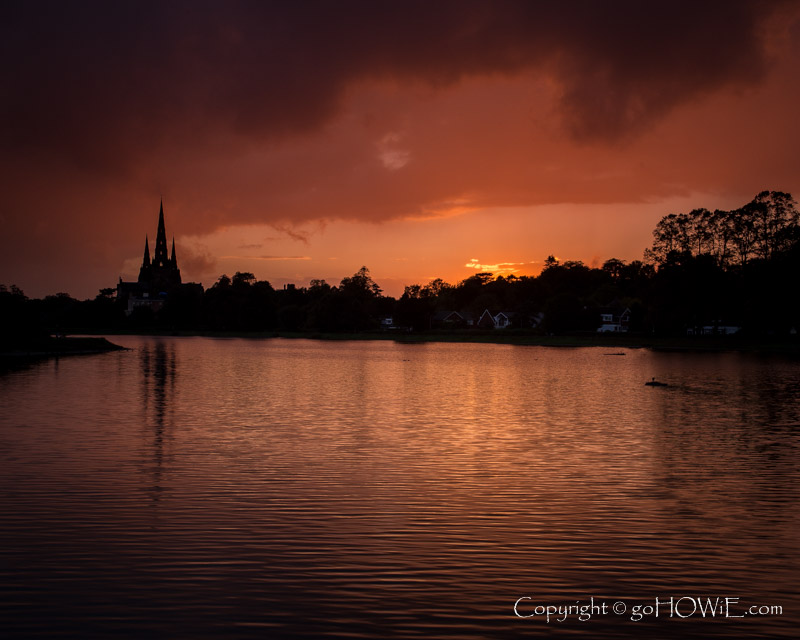 Lichfield cathedral and its reflection at sunset over Stowe Pool, Staffordshire
