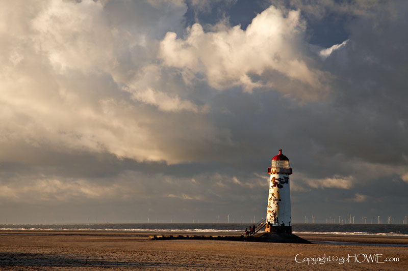 Talacre beach and lighthouse with dramatic winter storm clouds overhead, North Wales